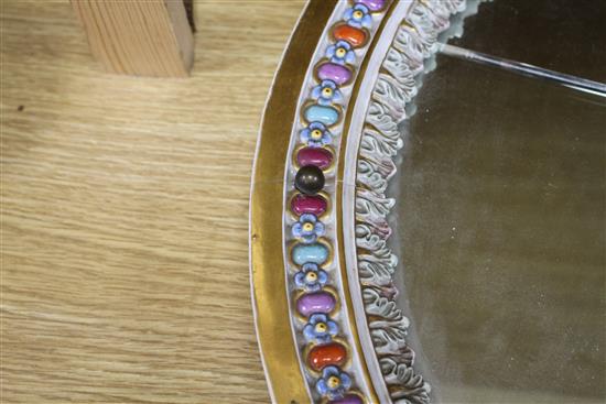 A Meissen porcelain dressing table mirror, surmounted with cherubs (a.f.), overall height 56cm